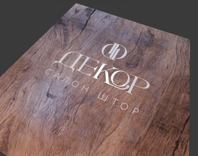 Commission from a furniture company. A board with a cut in logo of a client company.